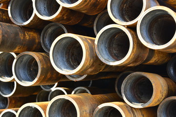 Pipes for drilling oil and gas wells stacked in a stack