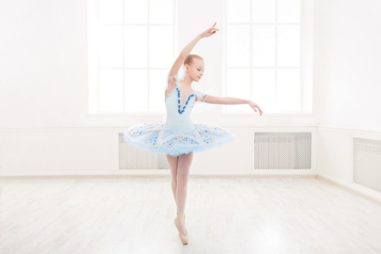 Ballet student exercising in ballet costume