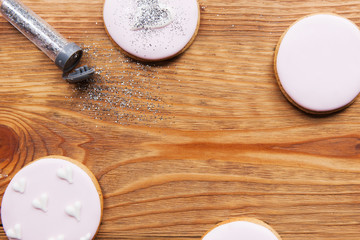 Gingerbread with icing on table with free space. Love background, wedding food, sweet dessert, baking concept