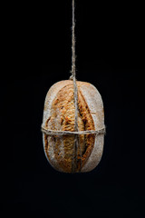 bread hanging on a rope