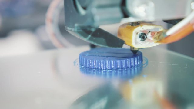 working 3d printer sequence. 3d printer prints a plastic part, maybe a piece of jewelry or an item of art
