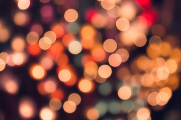 Obraz premium Vintage tone bokeh on dark romantic magic night background colorful.