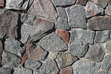 Rubble gray and brown stone wall, rubblework