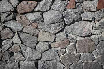 Rubble gray and brown stone wall, rubblework
