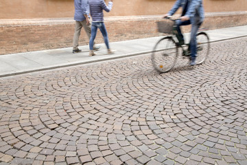 Cyclist on Cobblestone Street, Modena