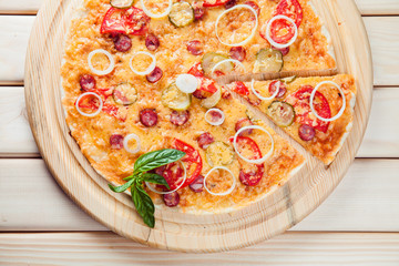 Assorted Pizza on the wooden background