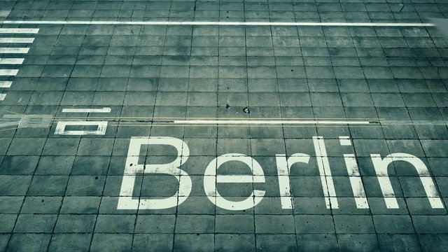Aerial view of commercial plane landing at Berlin airport. Travel to Germany conceptual 4K intro animation