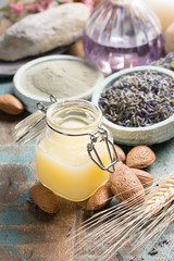 Nature cosmetics with essential oils and ancient minerals of  parfums, creams, soaps from fresh and dried lavender and roses flowers, wheat, almond nuts, green clay powder