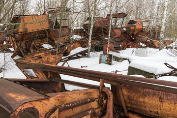 Fototapeta na wymiar Rusty Threshers in Snow Chernobyl