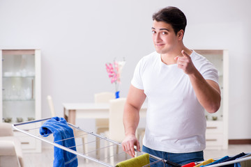 Man doing laundry at home