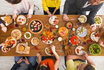 People eat healthy meals at served table dinner party