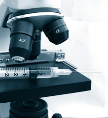 medical equipment: microscope and syringe