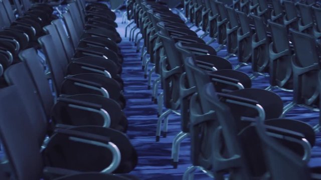 Chairs in a professional conference room or hall.