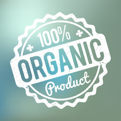 Organic Product rubber stamp white on a blue bokeh background.