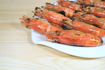 Flaming Grilled Whole River Prawns Served on White Plate with Selective Focus 