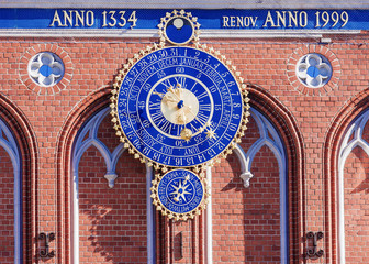 Astronomical clock in Riga, Latvia. The inscription on the building: built in 1334 restored in 1999