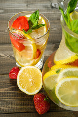 Lemonade with lemon and strawberry, mint and ice