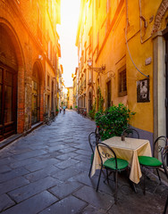 Narrow old cozy street in Lucca, Italy - obrazy, fototapety, plakaty