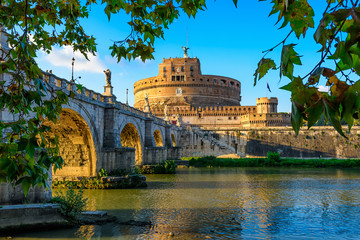Castle Sant Angelo (Mausoleum of Hadrian), bridge Sant Angelo and river Tiber in the rays of sunset in Roma. Italy