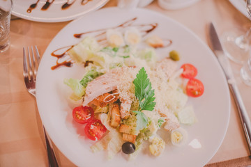 The Caesar salad prepared on the classical recipe.