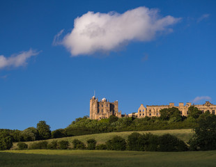 Fototapeta na wymiar Bolsover Castle in Sunlight with Blue Sky and White Fluffy Clouds