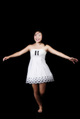Japanese American Woman Twirling In White Dress