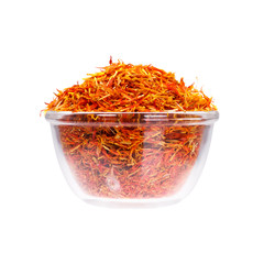 Fototapeta premium Safron stamens in saucepan on white background.