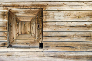 Timber made hatch in a wooden wall