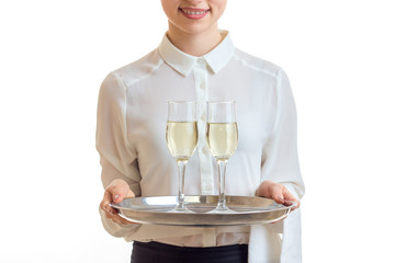 waitress in uniform holding a champagne on silver trey