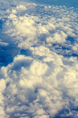 Naklejka na ściany i meble View on cloudscape from airplane window