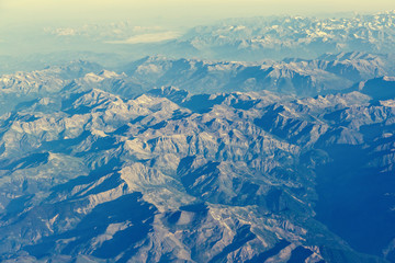 Aerial view of Alps mountains from airplane