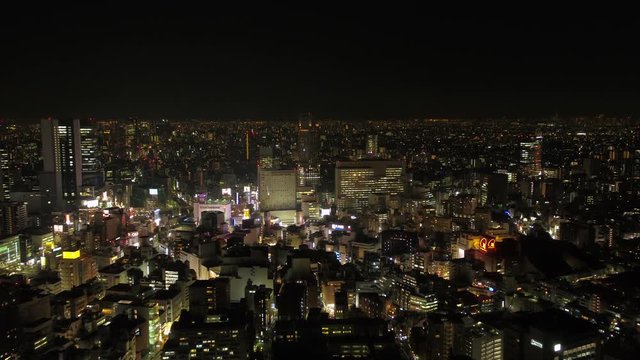 Japan Tokyo Aerial v19 Flying low towards famous Shibuya crossing panning down night 2/17
