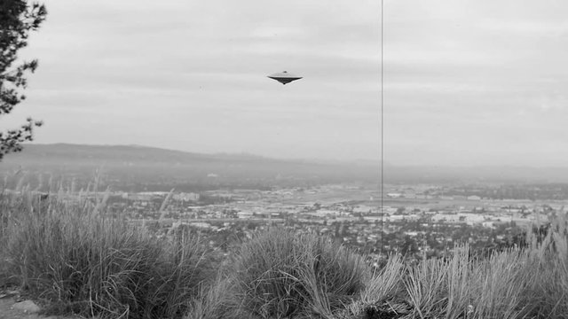 FLYING SAUCER OVER AN URBAN VALLEY