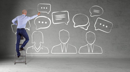 Businessman drawing discussion icons sketch on a wall 3D rendering