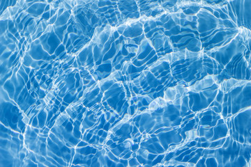Fototapeta na wymiar Surface of swimming pool water background