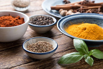 spices with ingredients on dark background. asian food, healthy or cooking concept.