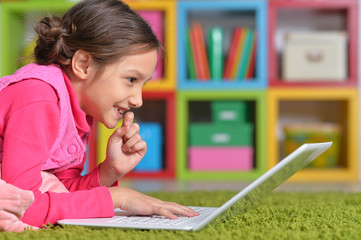  little girl using laptop