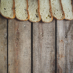 Background - pieces of white bread on a wooden surface