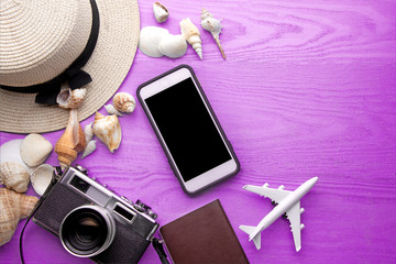 Summer holiday background, travel concept with camera and mobile phone
 on wooden table background