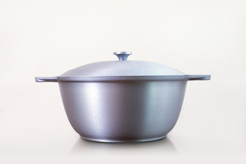 Cast iron cauldron. Kazan - traditional asian cast iron cauldron on white background.