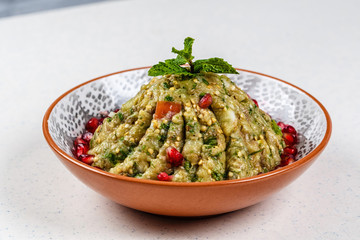 Raheb Salad served with pomegranate.