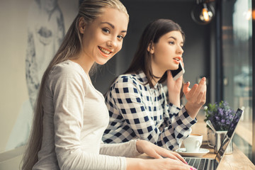 Young women friends in a coffee shop free time