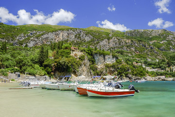 Pier with boats in Paleokastritsa, Corfu, Greece.