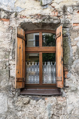 Old window on ancient wall