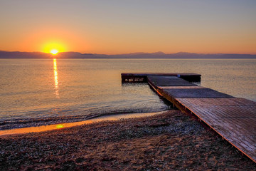 Sunrise on the sea in Moraitika, Greece.