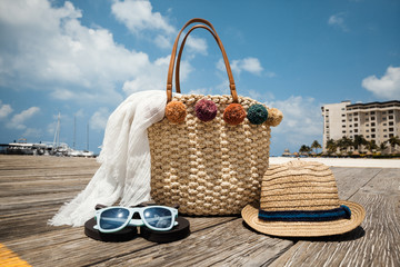 Summer accessories on the wooden bridge at the tropical beach