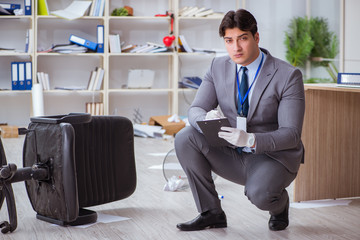 Young man during crime investigation in office