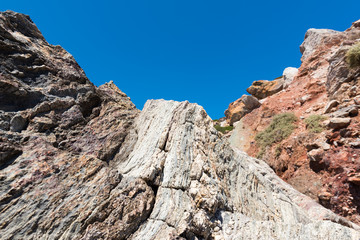 Volcanic rock formations on Paleochori Beach located in the south of Milos. Cyclades Islands, Greece.