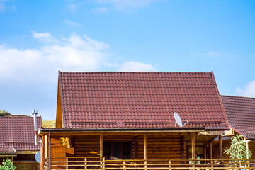 Roof from metal profile -  House of logs