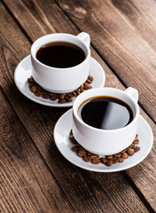 Two cups of espresso on brown napkin